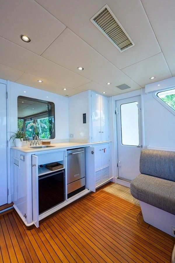 a kitchen with a couch and a table aboard OUR WAY Yacht for Sale