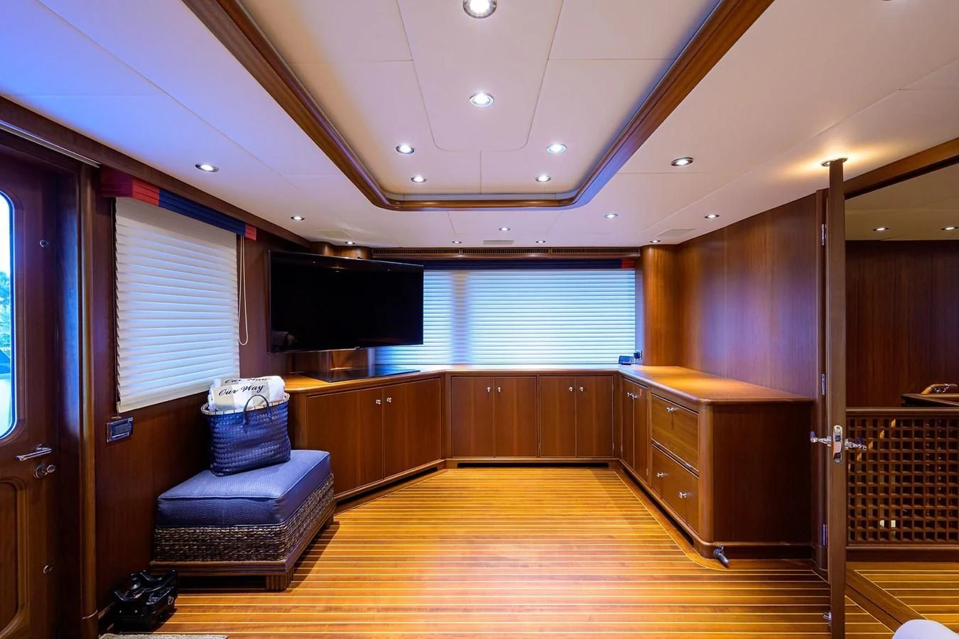 a room with a couch and a tv aboard OUR WAY Yacht for Sale