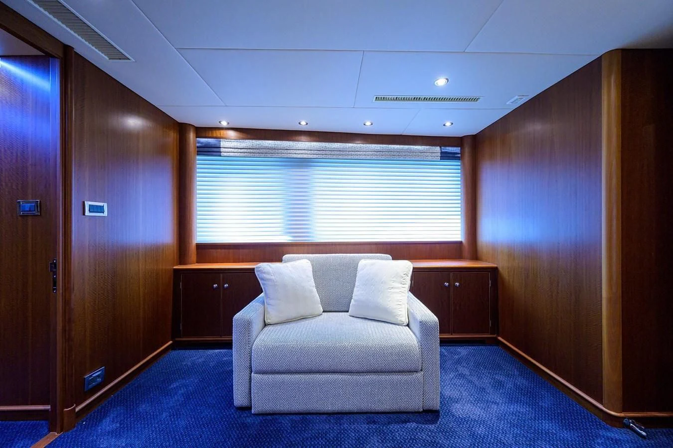 a room with a couch and a window aboard OUR WAY Yacht for Sale
