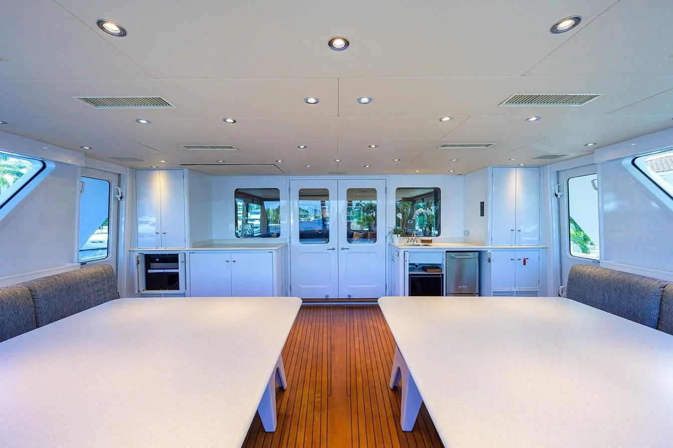 a large kitchen with a table and chairs aboard OUR WAY Yacht for Sale