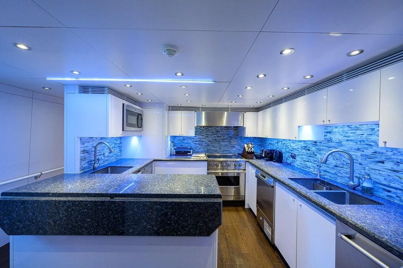 a kitchen with a large island aboard OUR WAY Yacht for Sale