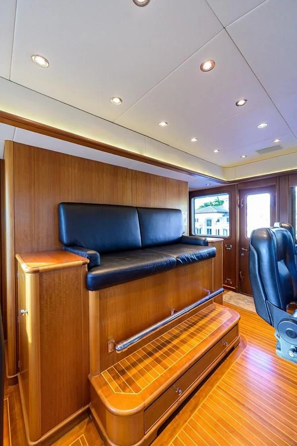 a couch and a chair in a room aboard OUR WAY Yacht for Sale