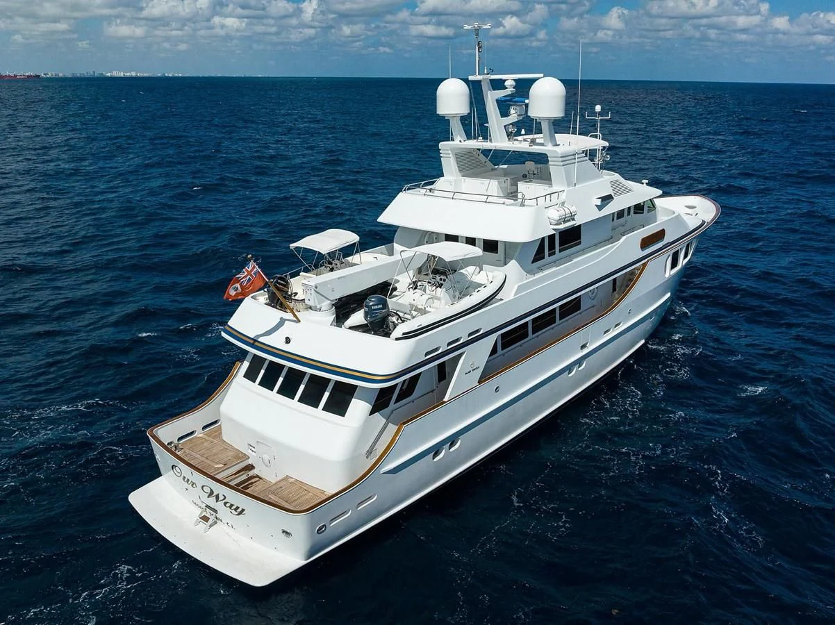 a white yacht in the water aboard OUR WAY Yacht for Sale