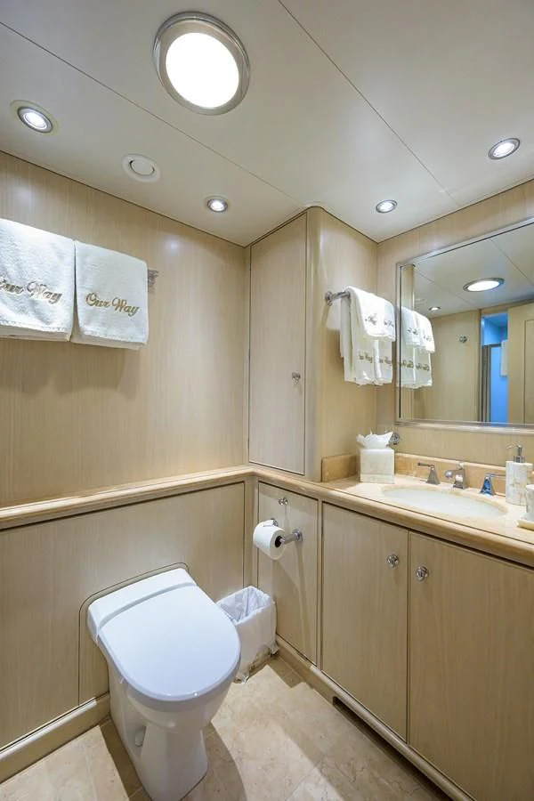 a bathroom with a toilet and a sink aboard OUR WAY Yacht for Sale