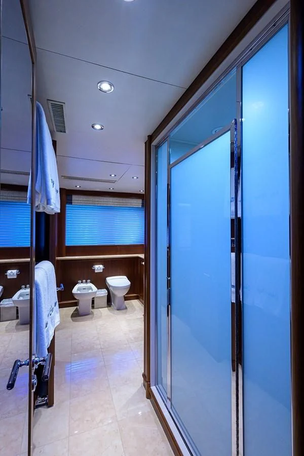 a bathroom with a blue door aboard OUR WAY Yacht for Sale