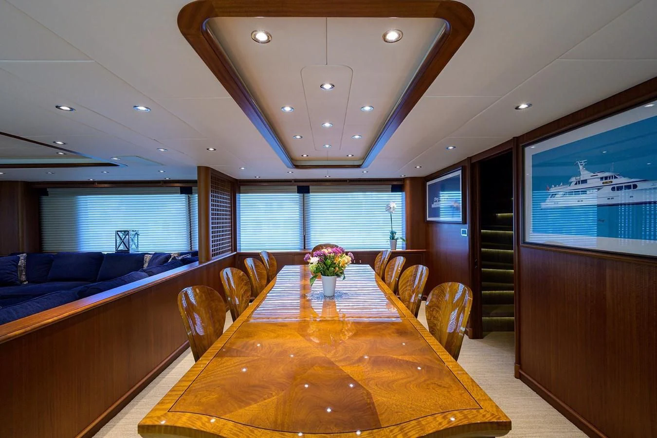 a large room with a table and chairs aboard OUR WAY Yacht for Sale