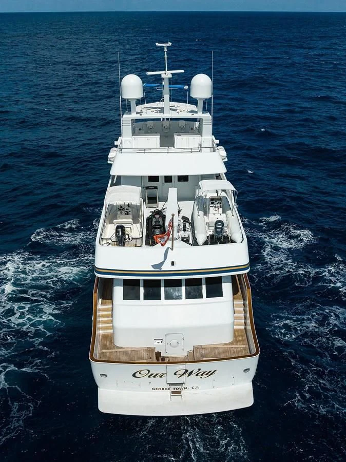 a white boat in the water aboard OUR WAY Yacht for Sale