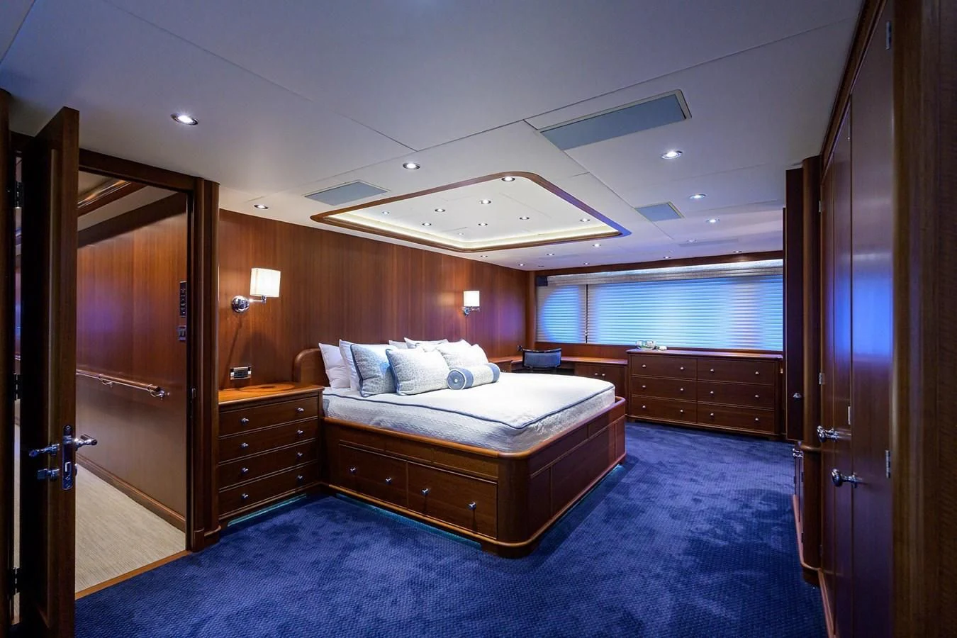 a bedroom with a bed and a door aboard OUR WAY Yacht for Sale