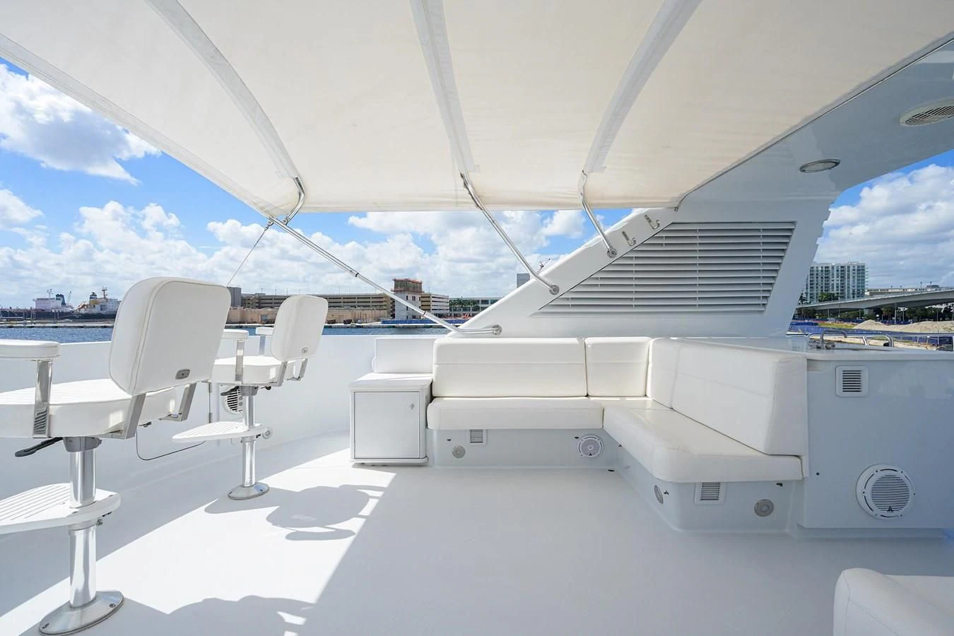 a large white boat with chairs and tables aboard OUR WAY Yacht for Sale