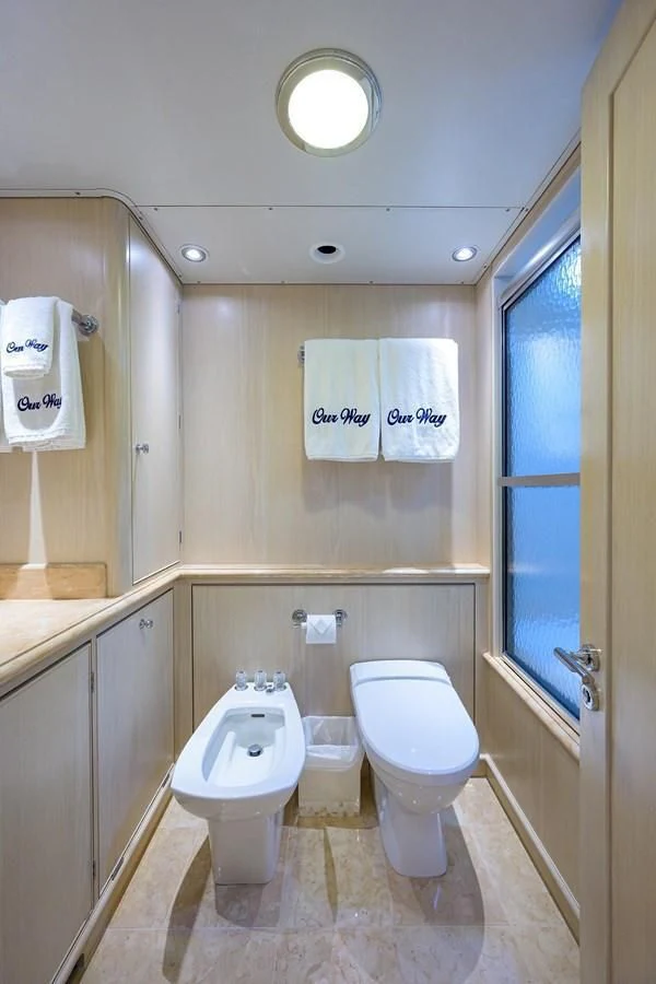 a bathroom with a toilet and sink aboard OUR WAY Yacht for Sale