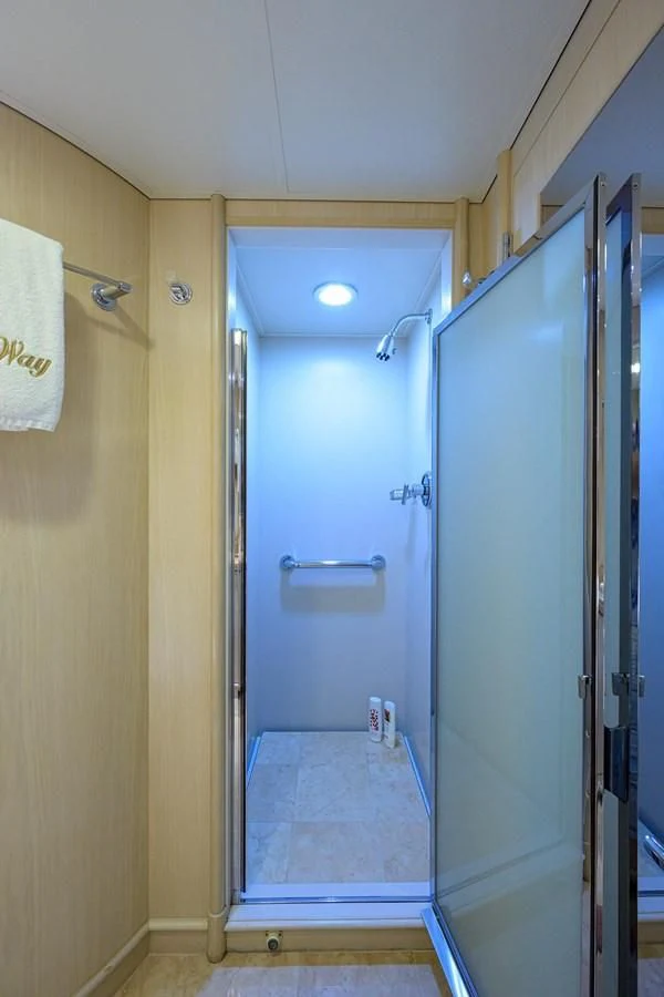 a bathroom with a blue door aboard OUR WAY Yacht for Sale