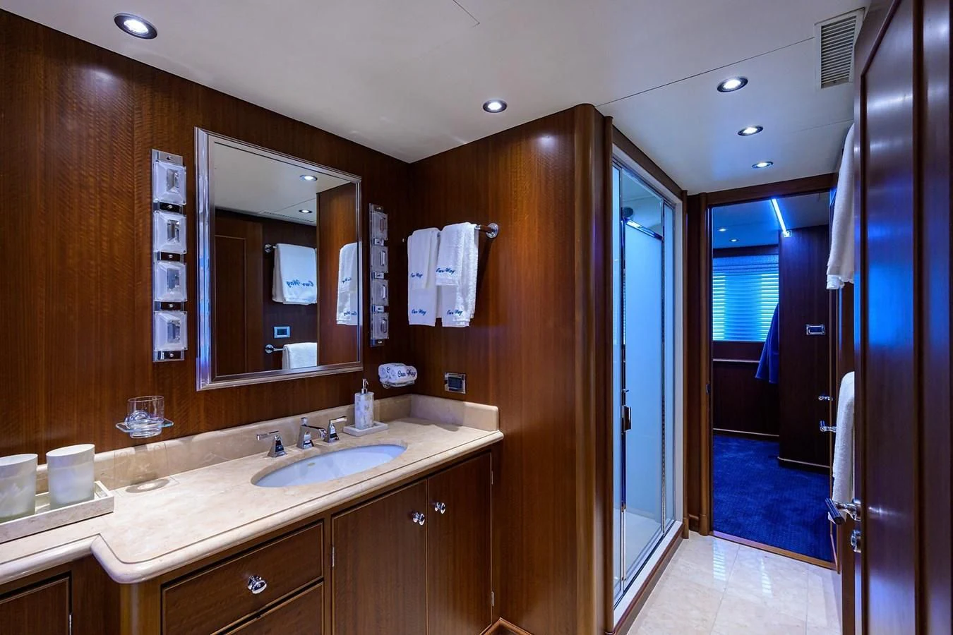 a bathroom with a sink and a mirror aboard OUR WAY Yacht for Sale