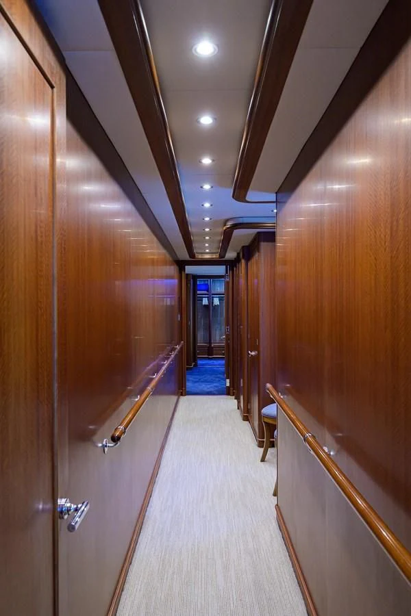 a hallway with a door and railing aboard OUR WAY Yacht for Sale