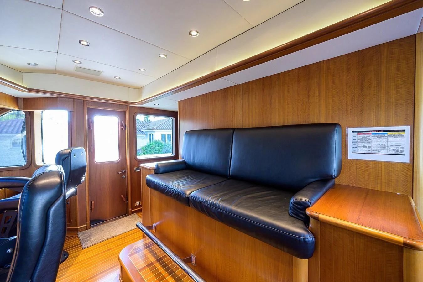 a leather couch in a train aboard OUR WAY Yacht for Sale