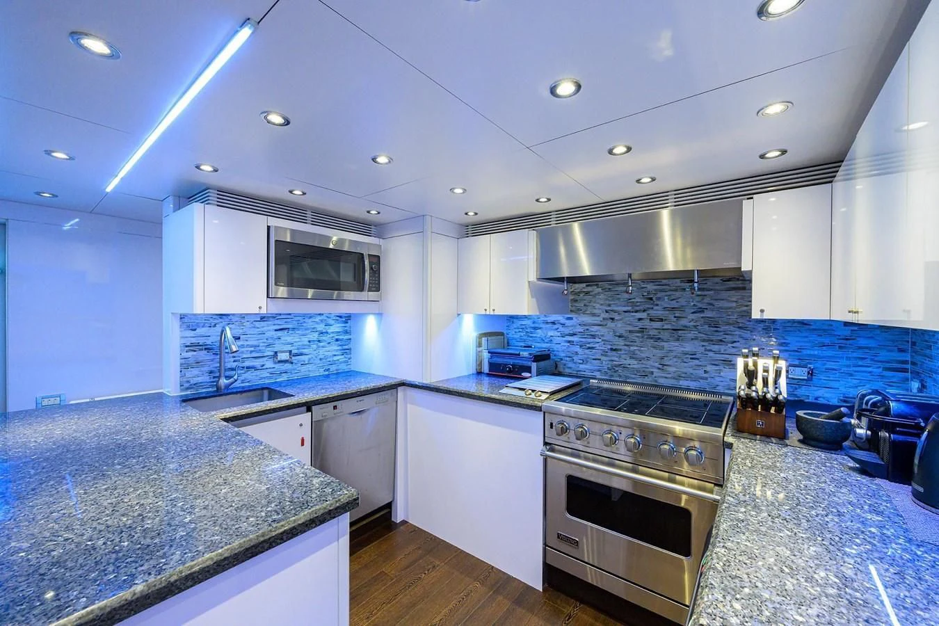 a kitchen with a marble counter top aboard OUR WAY Yacht for Sale