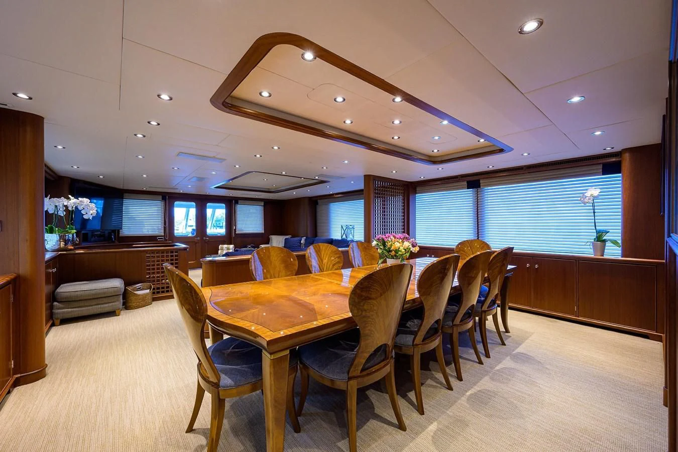 a large dining room with a large table and chairs aboard OUR WAY Yacht for Sale