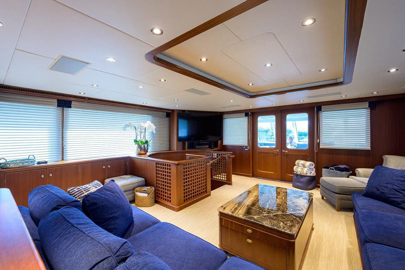 a living room with a couch and a table aboard OUR WAY Yacht for Sale