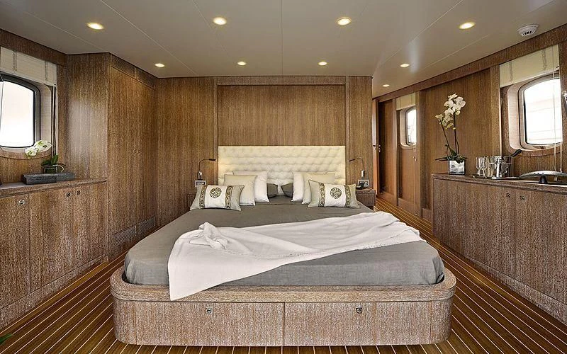 a large bed in a room aboard BULLY Yacht for Sale