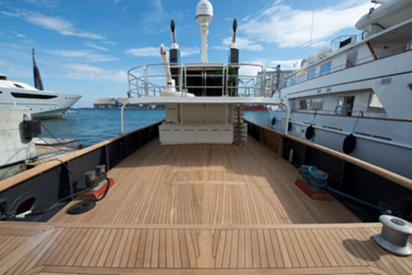 a deck with a deck and boats aboard BULLY Yacht for Sale