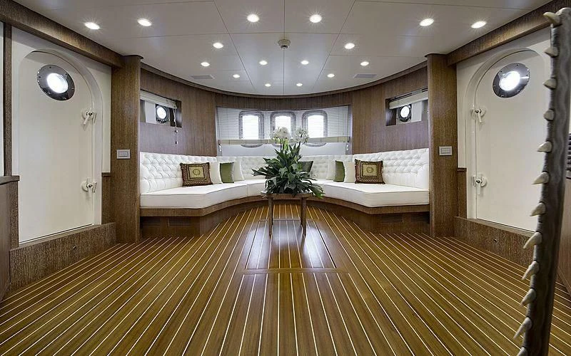 a large room with a wood floor and a large mirror aboard BULLY Yacht for Sale