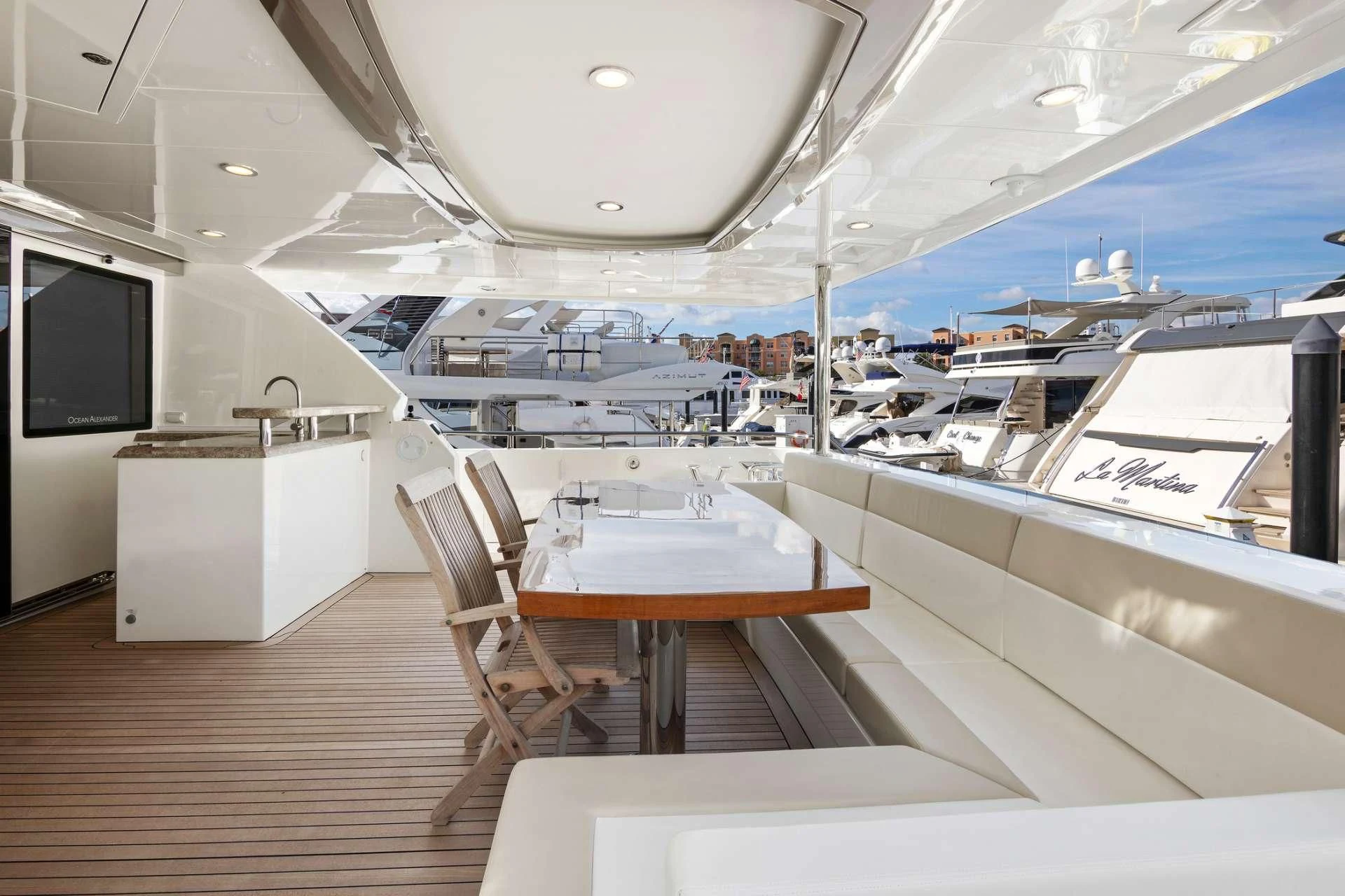 a room with a table and chairs aboard OCEAN ROSE Yacht for Sale