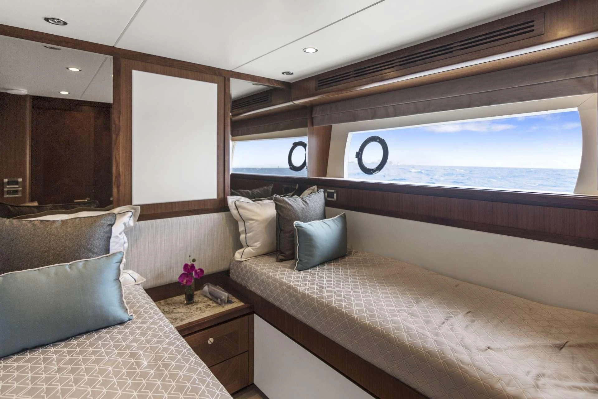 a room with a bed and a window aboard OCEAN ROSE Yacht for Sale