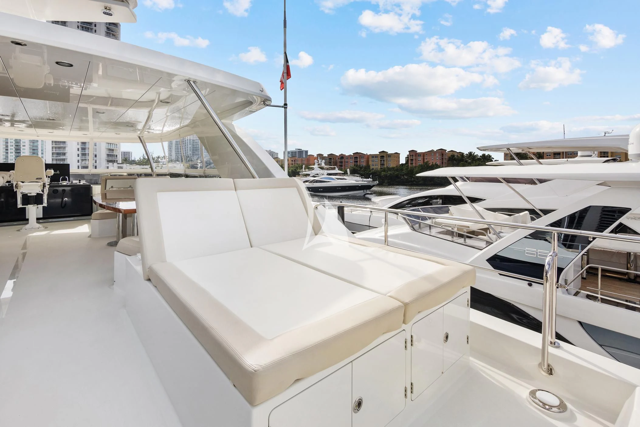 a large white building with a large balcony and a pool aboard OCEAN ROSE Yacht for Sale