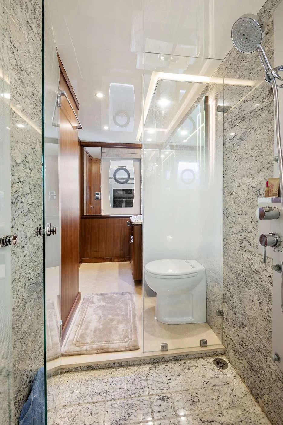 a bathroom with a toilet and a shower aboard OCEAN ROSE Yacht for Sale