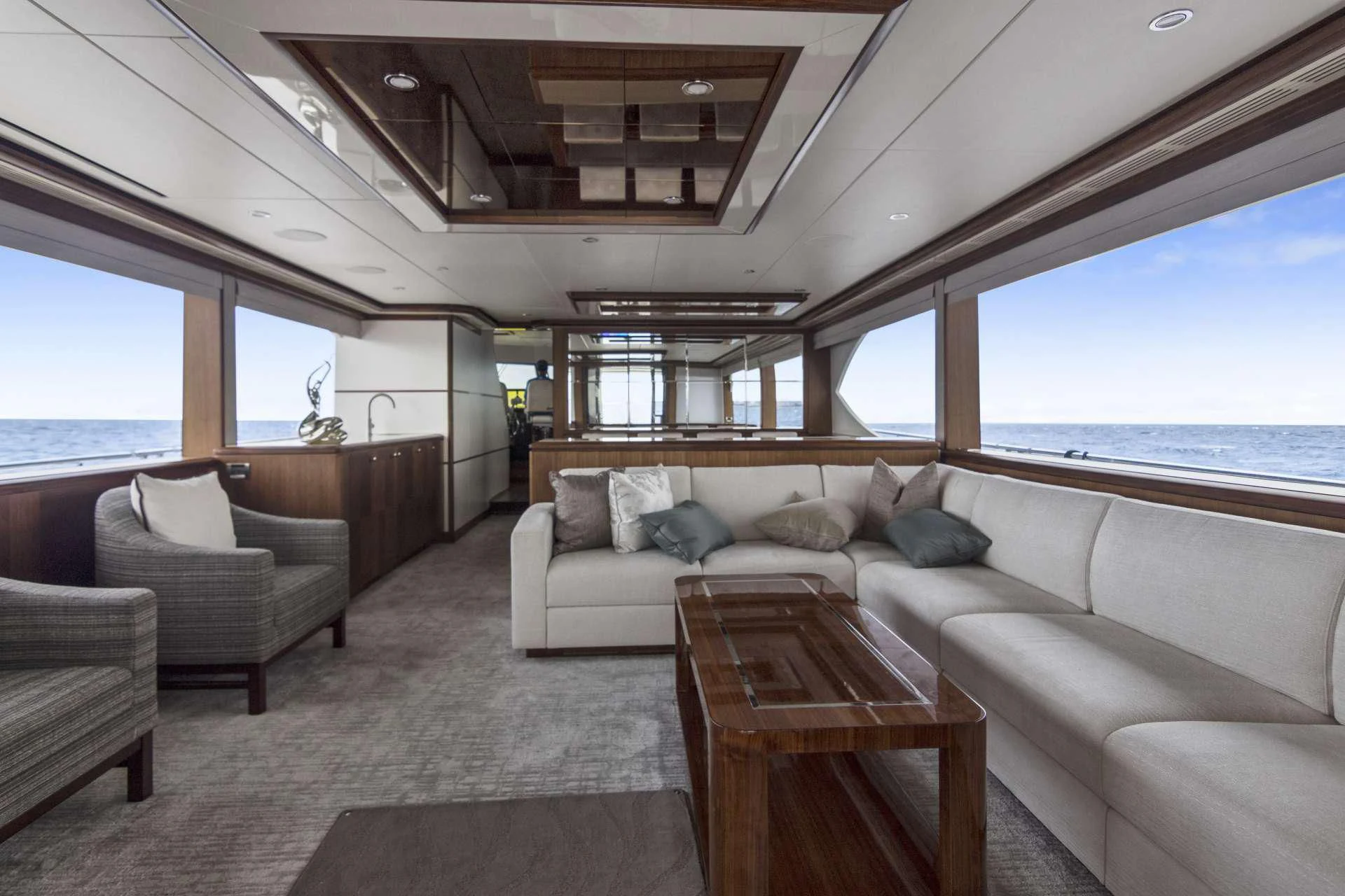 a living room with a large window aboard OCEAN ROSE Yacht for Sale