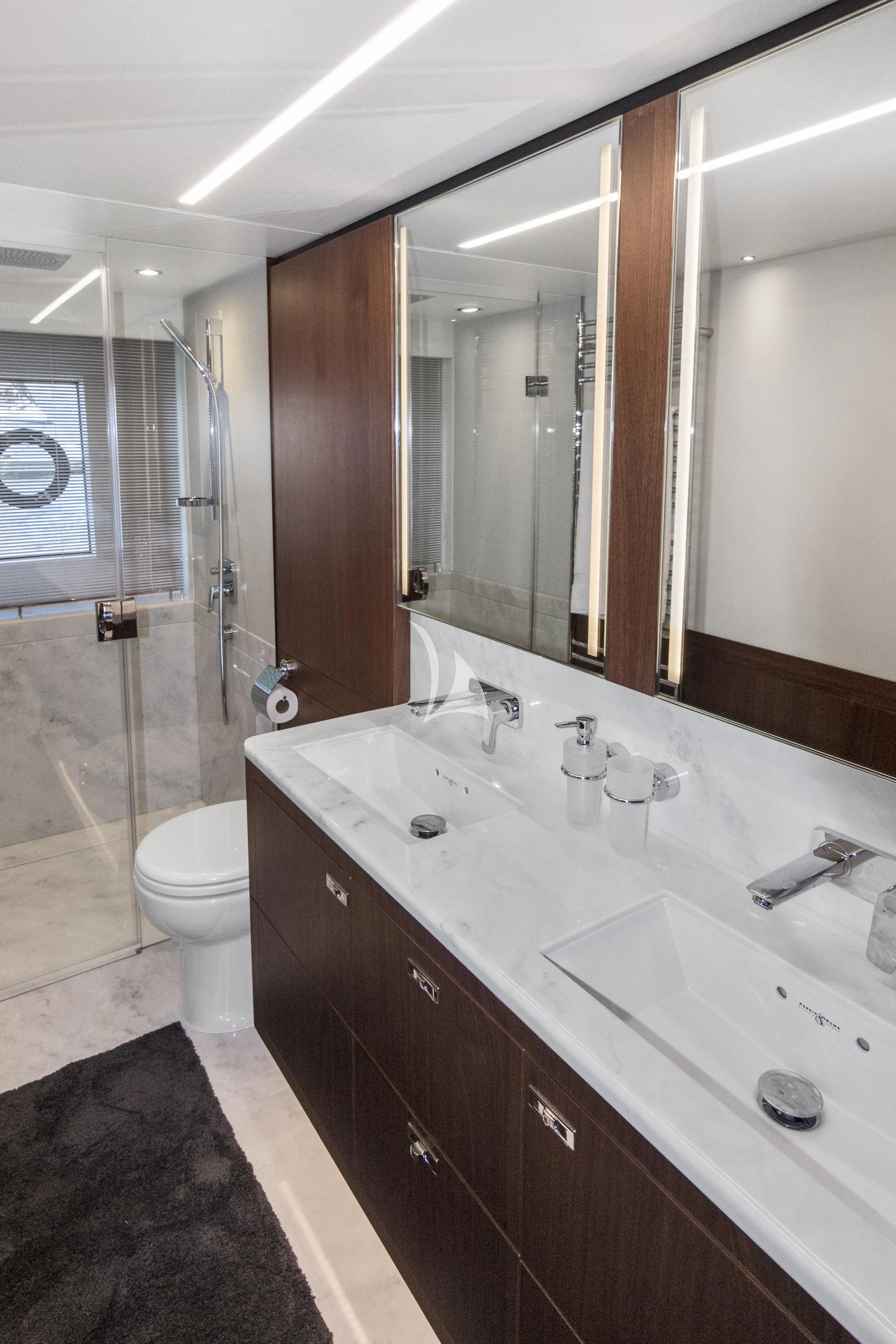 a bathroom with a large mirror aboard OCEAN ROSE Yacht for Sale