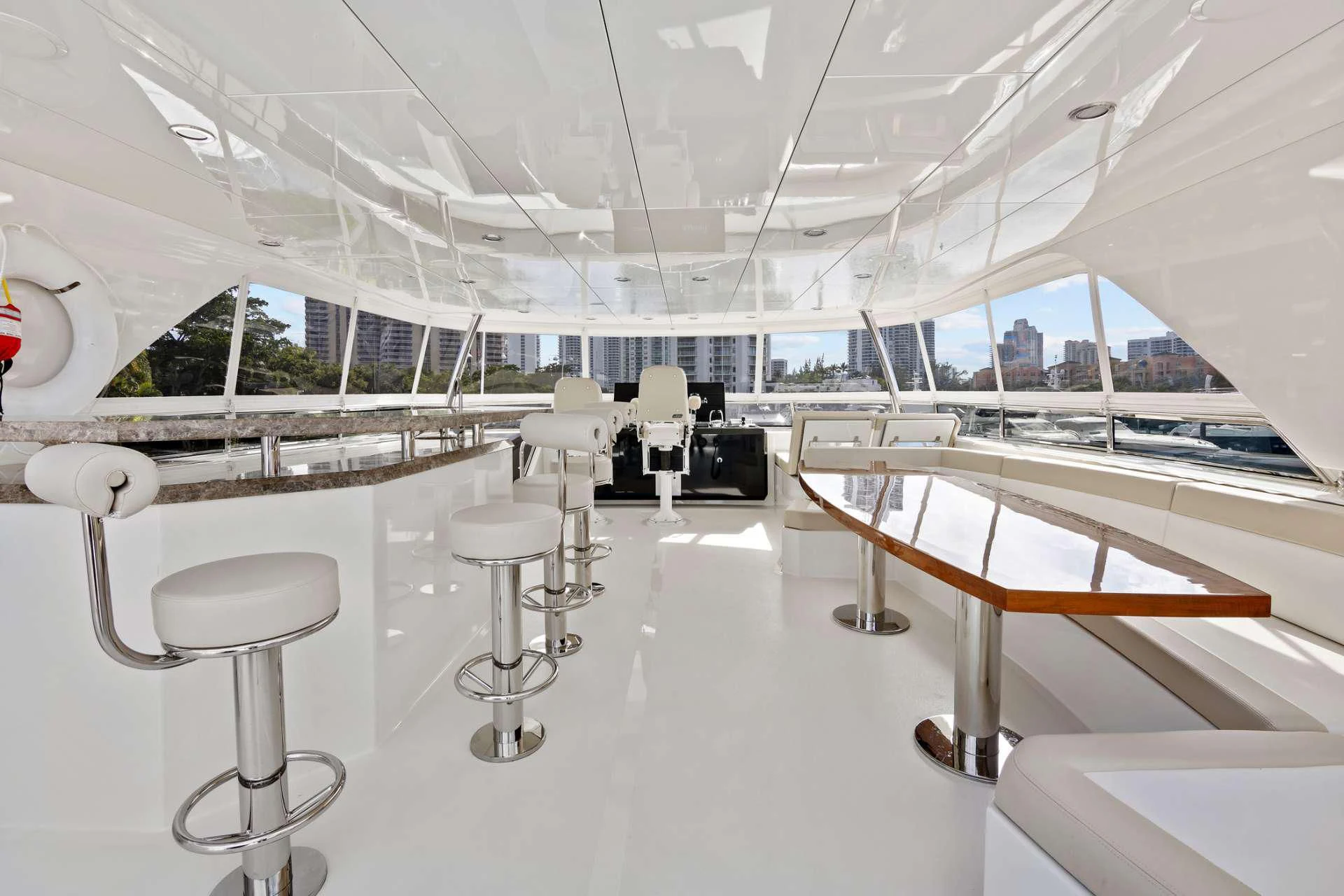 a room with tables and chairs aboard OCEAN ROSE Yacht for Sale