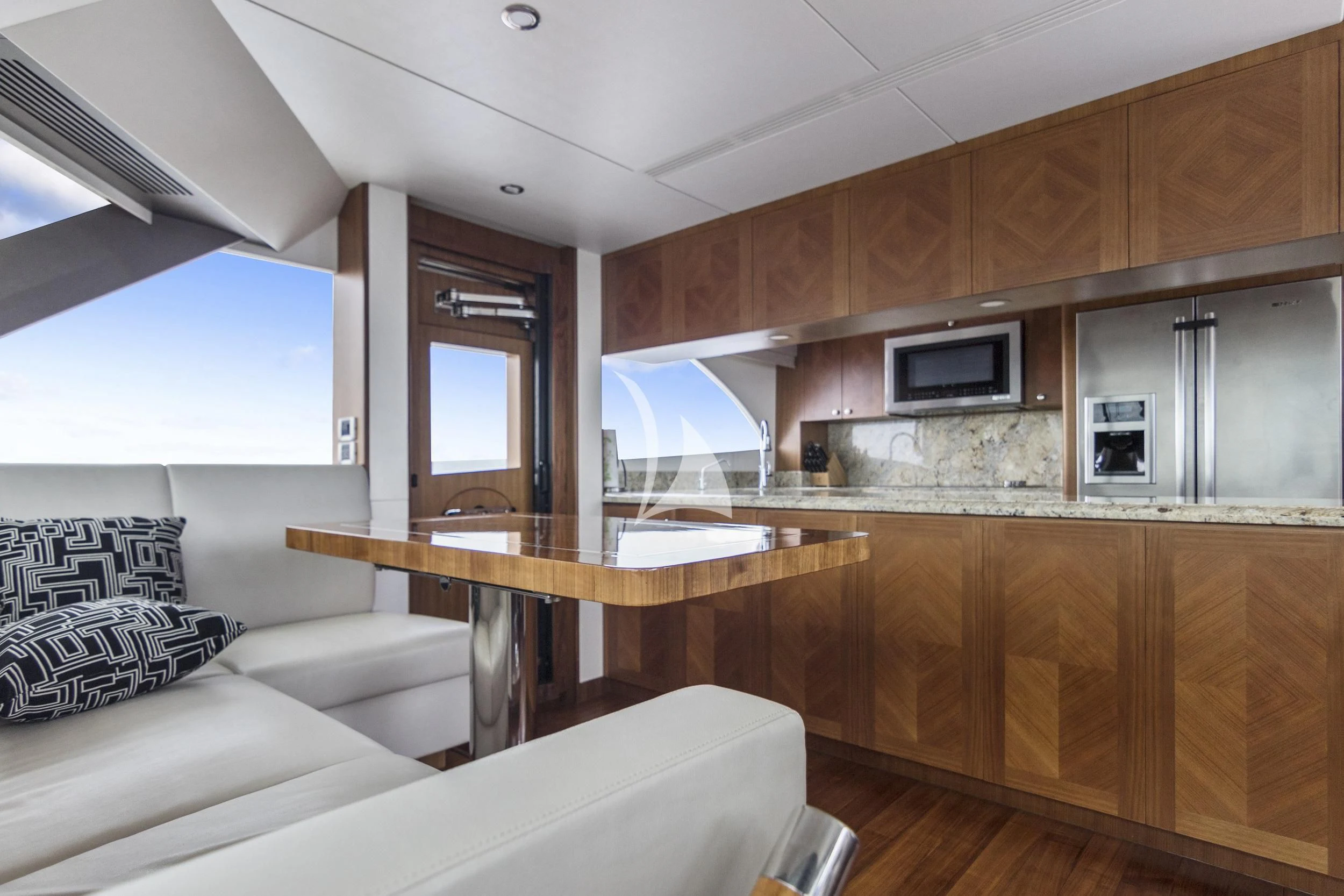 a kitchen with wooden cabinets aboard OCEAN ROSE Yacht for Sale