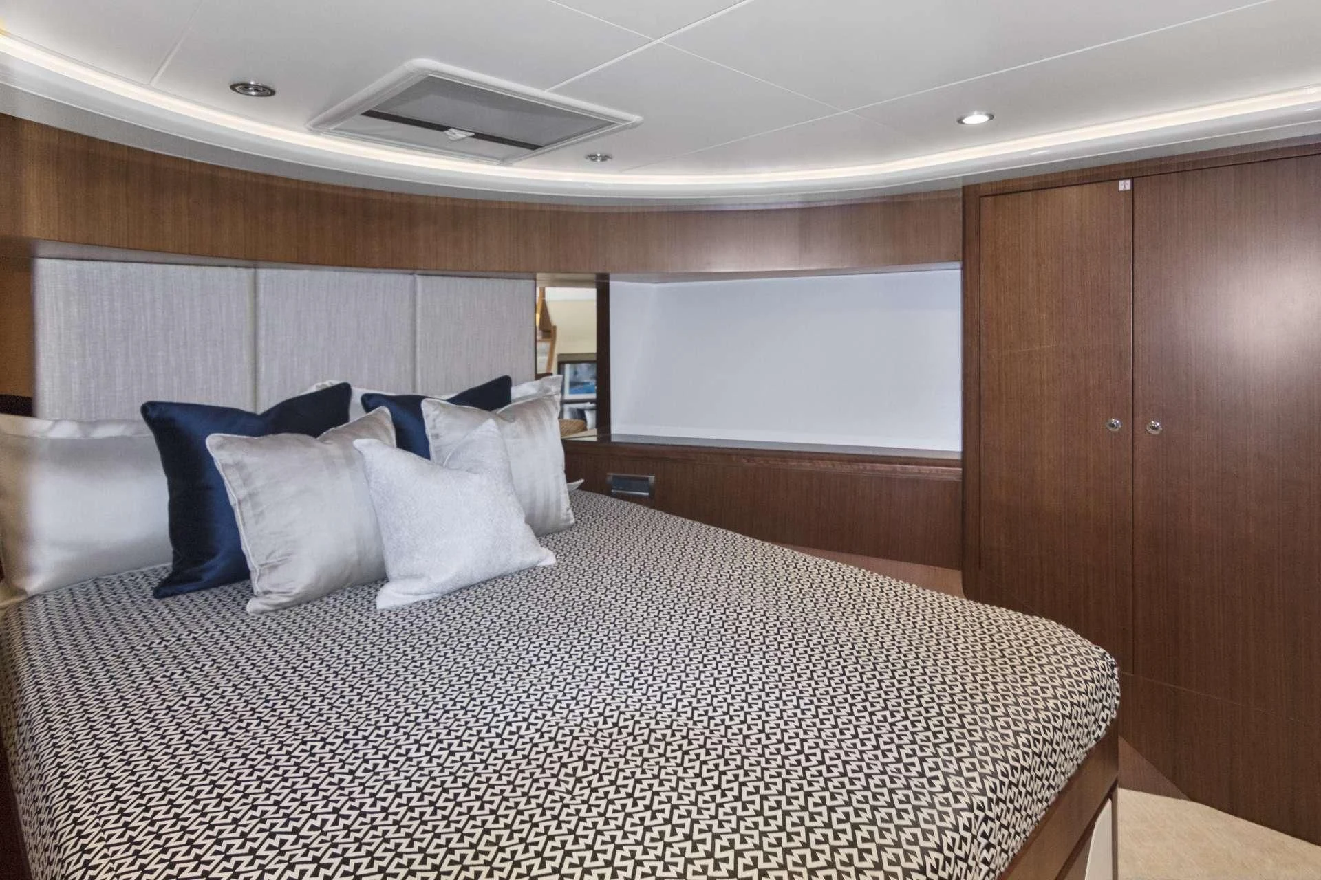 a bed with white sheets aboard OCEAN ROSE Yacht for Sale
