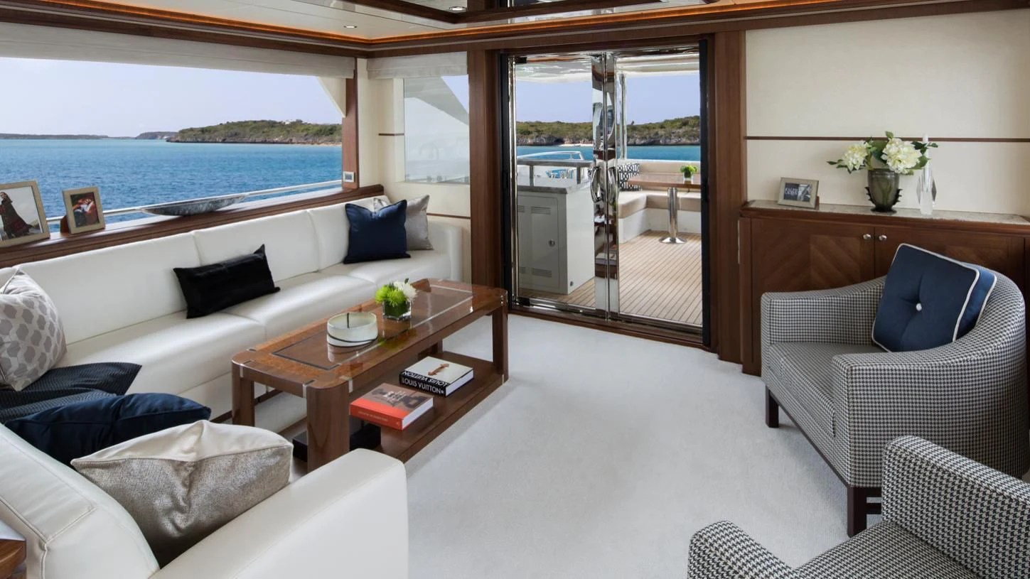 a living room with a large window aboard OCEAN ROSE Yacht for Sale