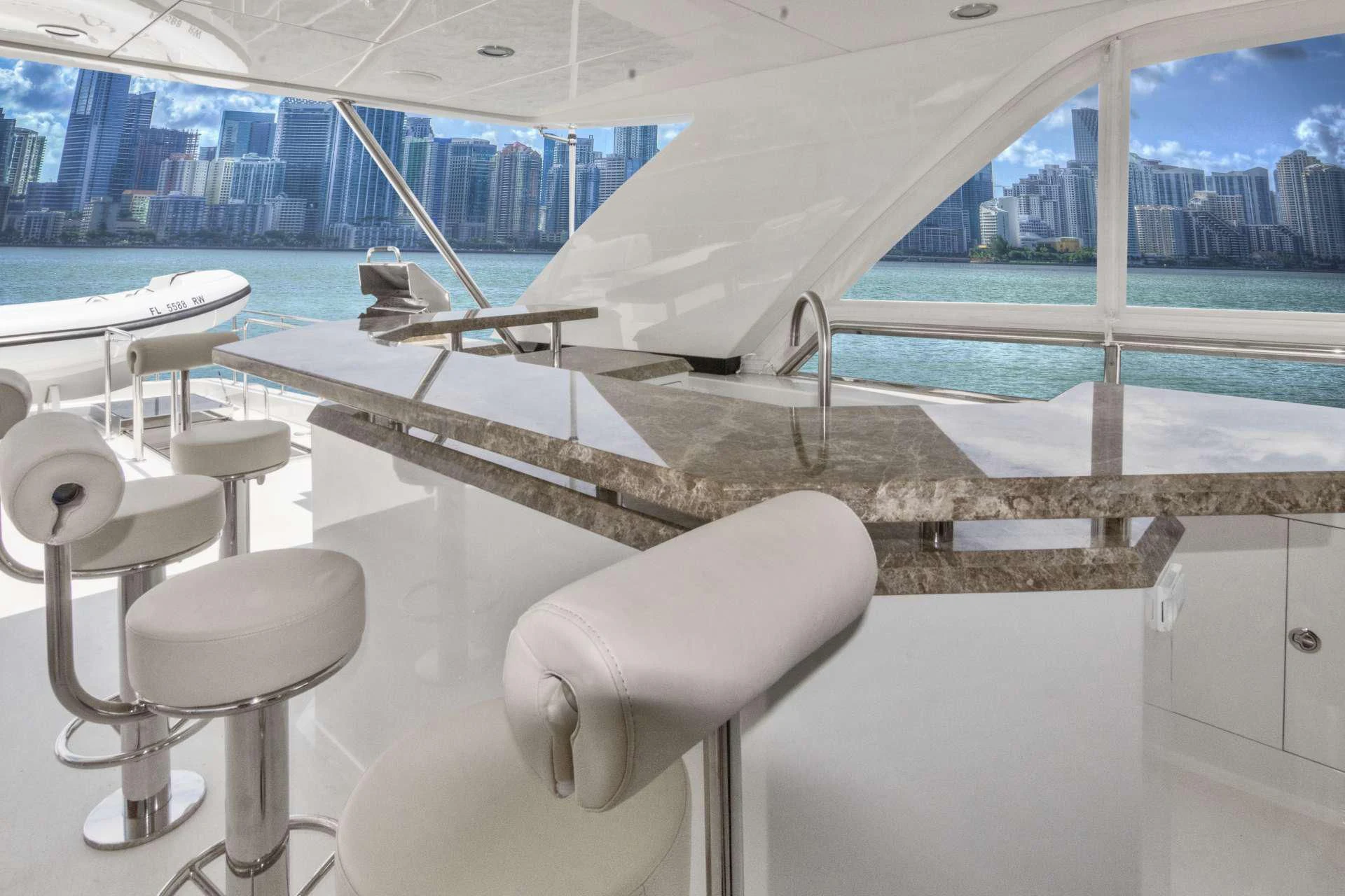 a room with chairs and tables aboard OCEAN ROSE Yacht for Sale