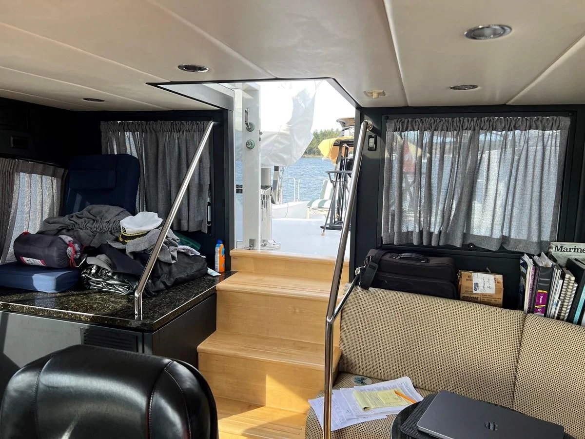 a room with a bed and a desk aboard OREGON MIST Yacht for Sale