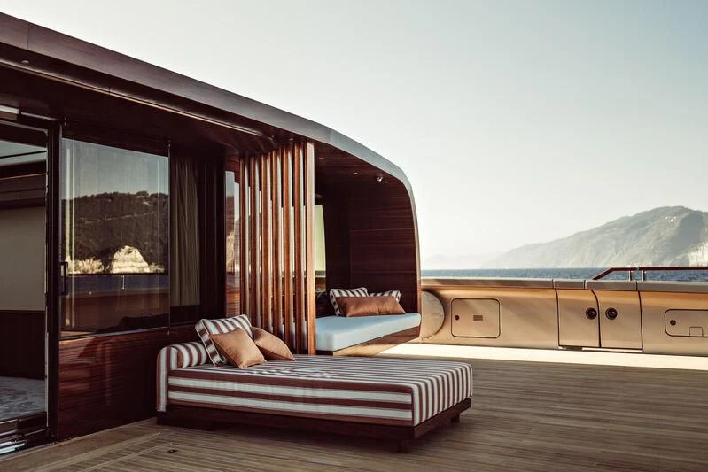 a room with a bed and a large window aboard ARTEXPLORER Yacht for Sale
