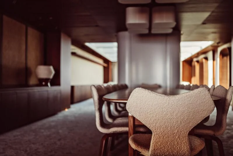a room with a couch and chairs aboard ARTEXPLORER Yacht for Sale