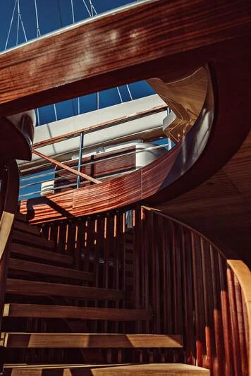 a staircase with a spiral staircase aboard ARTEXPLORER Yacht for Sale