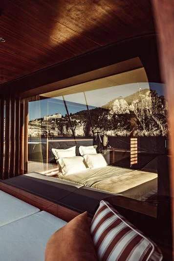 a bed with a canopy over it aboard ARTEXPLORER Yacht for Sale