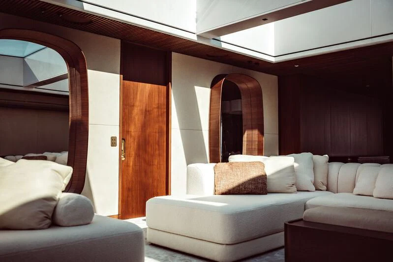 a room with a couch and a mirror aboard ARTEXPLORER Yacht for Sale