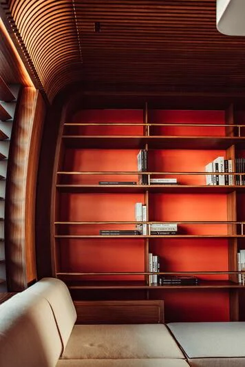 a bookshelf with books on it aboard ARTEXPLORER Yacht for Sale