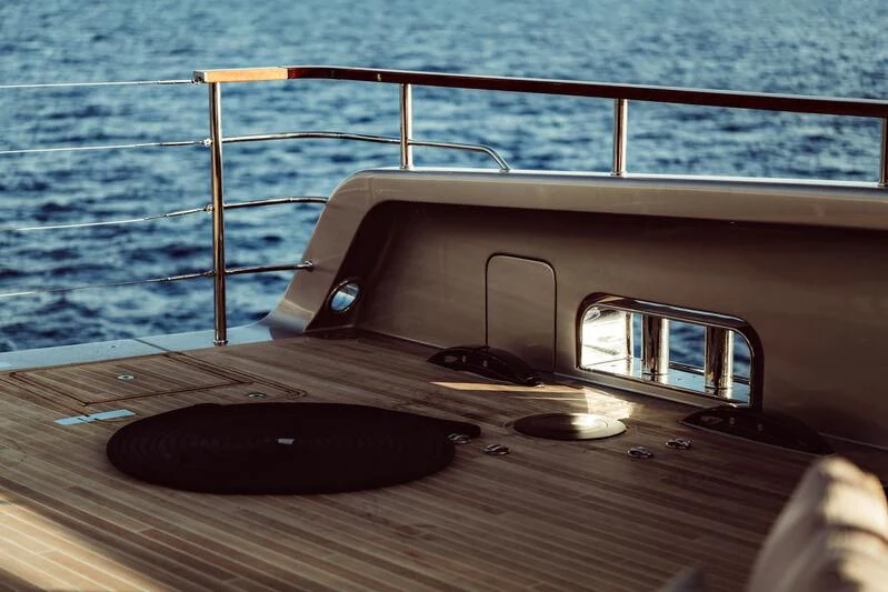 a wood table with a laptop on it aboard ARTEXPLORER Yacht for Sale