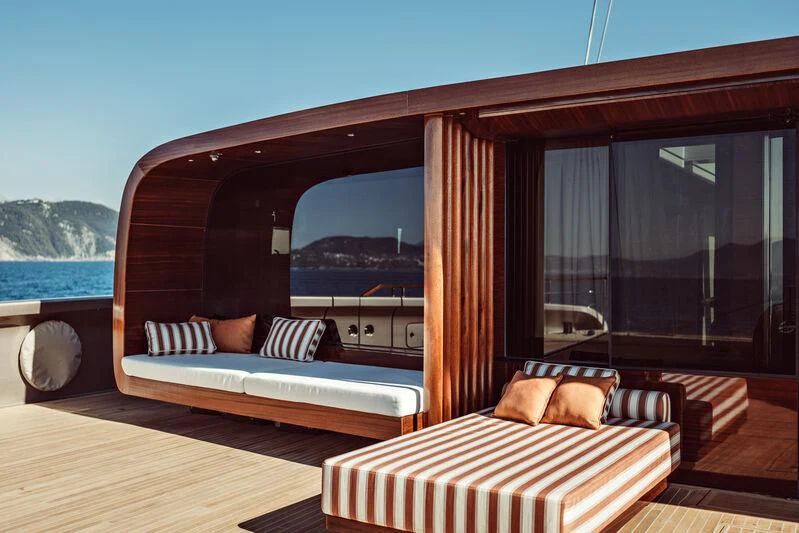 a room with a bed and a large window aboard ARTEXPLORER Yacht for Sale