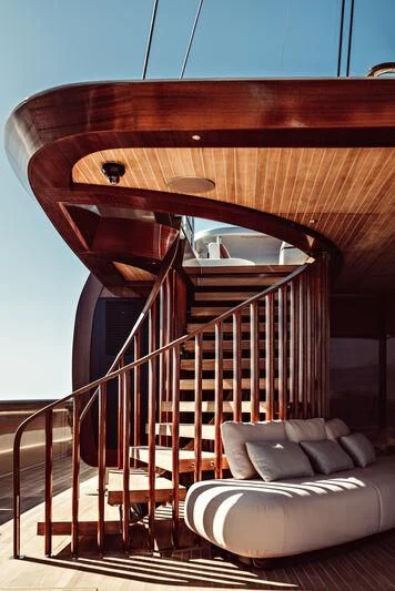 a wooden spiral staircase aboard ARTEXPLORER Yacht for Sale