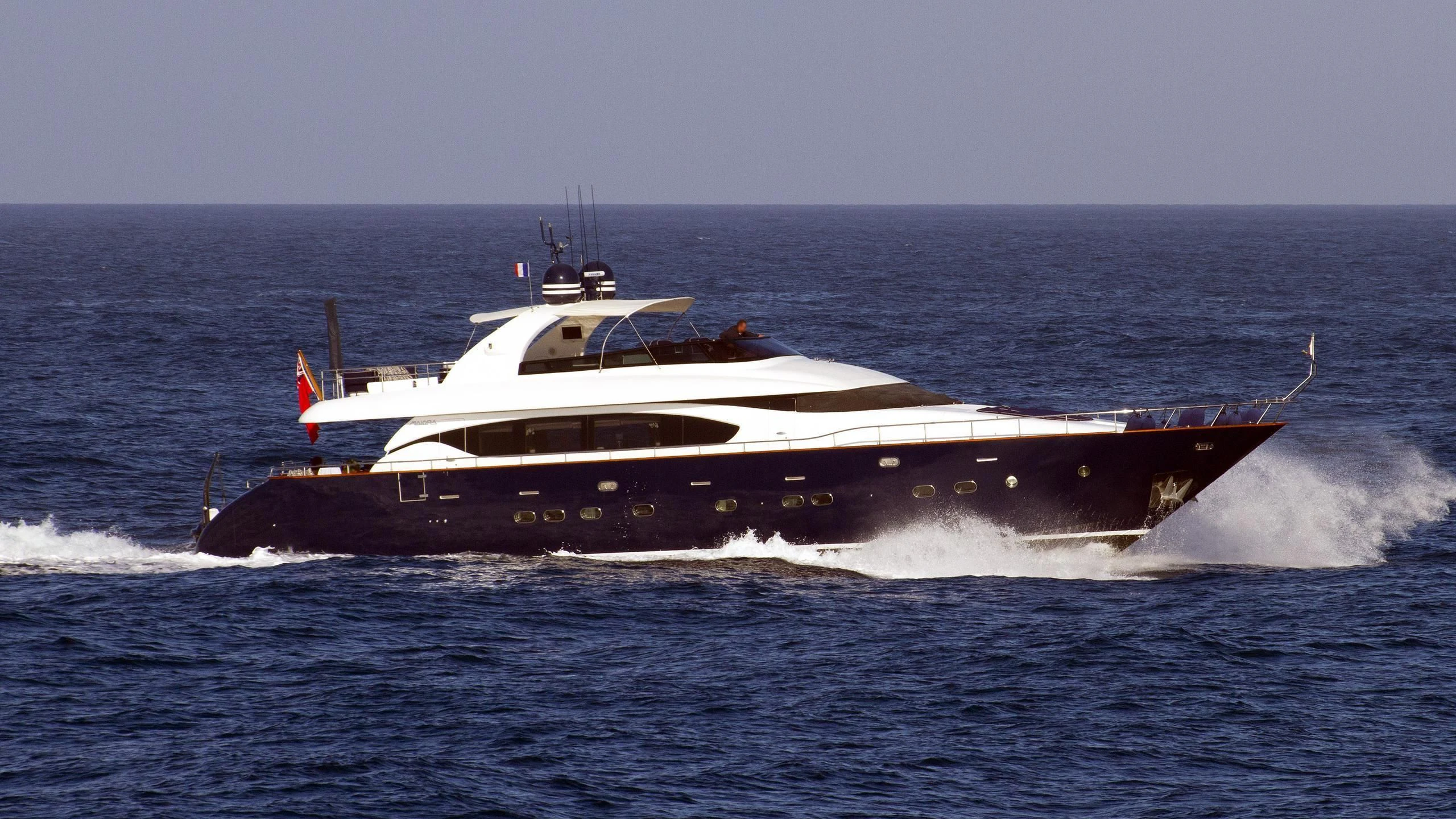 a military ship in the water aboard ASHA Yacht for Sale