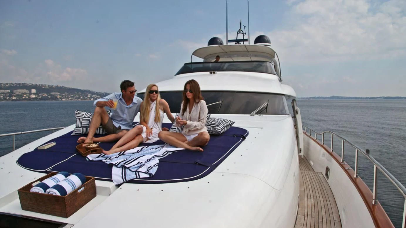 a group of people sitting on a boat aboard ASHA Yacht for Sale