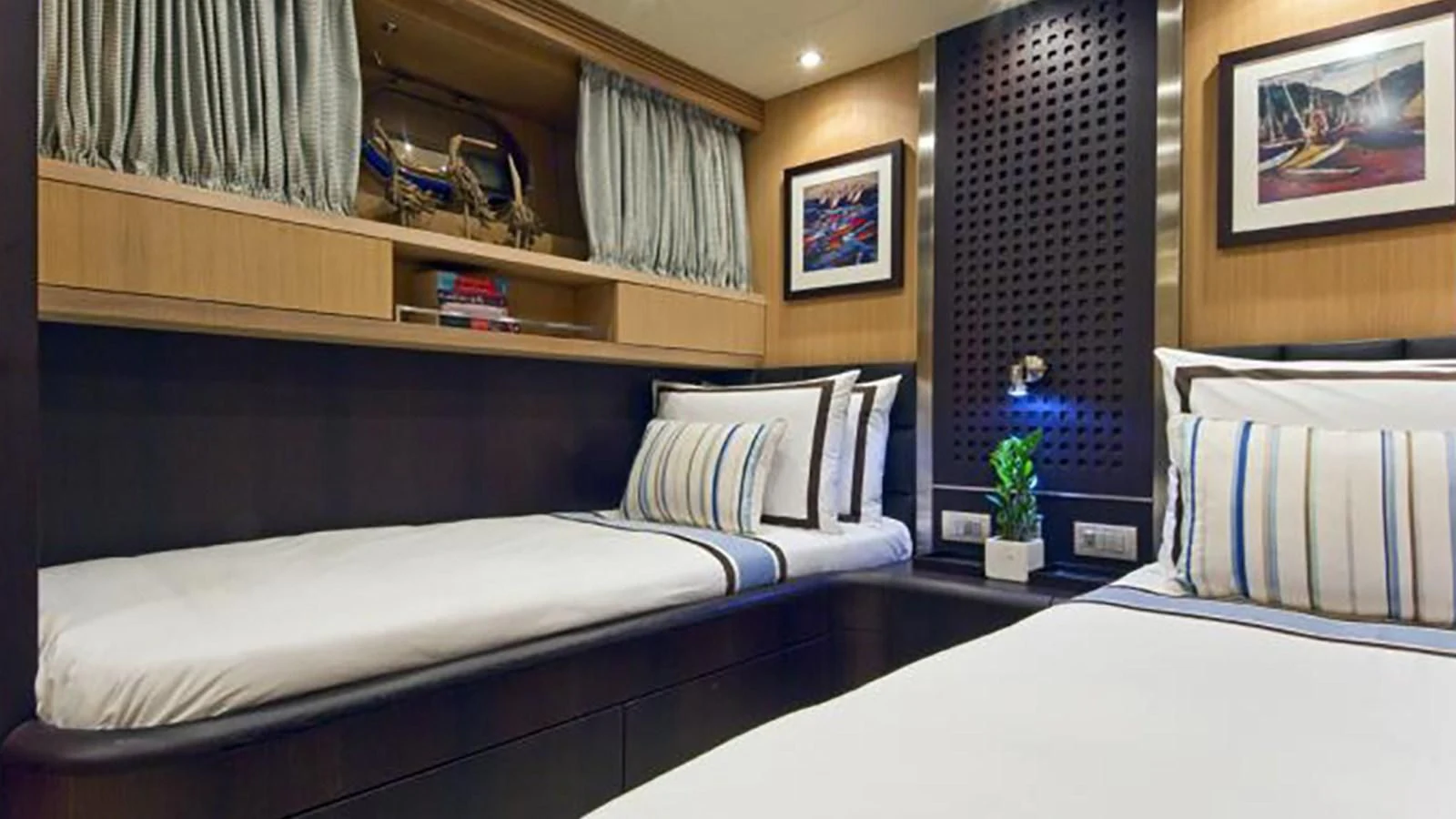 a room with two beds aboard ASHA Yacht for Sale