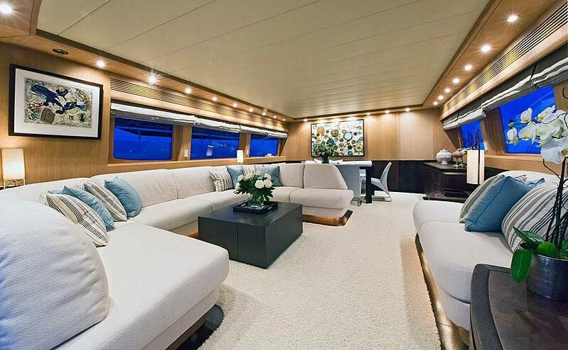 a room with couches and a table aboard ASHA Yacht for Sale
