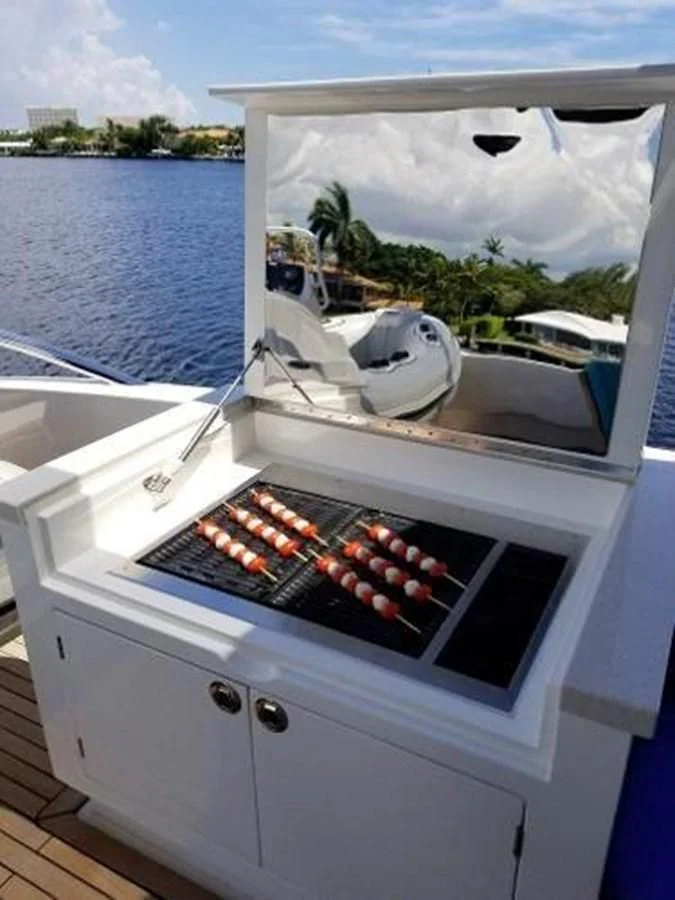 a white boat with red berries on it aboard HAMPTON EURO 830 Yacht for Sale